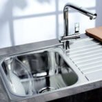 Close-up of the Reginox Minister 10 single bowl stainless steel kitchen sink.