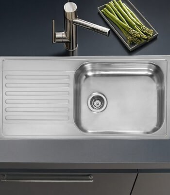 Close-up of the Reginox Minister 10 single bowl stainless steel kitchen sink.