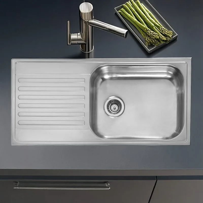 Close-up of the Reginox Minister 10 single bowl stainless steel kitchen sink.