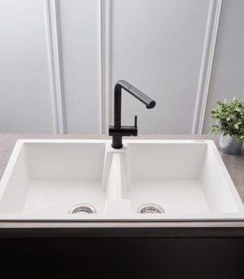Reginox Amsterdam 20 double bowl pure white quartz/granite kitchen sink installed in a contemporary kitchen.