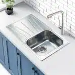 Close-up of the overflow system on the Reginox Diplomat 10 Lux single bowl stainless steel kitchen sink.