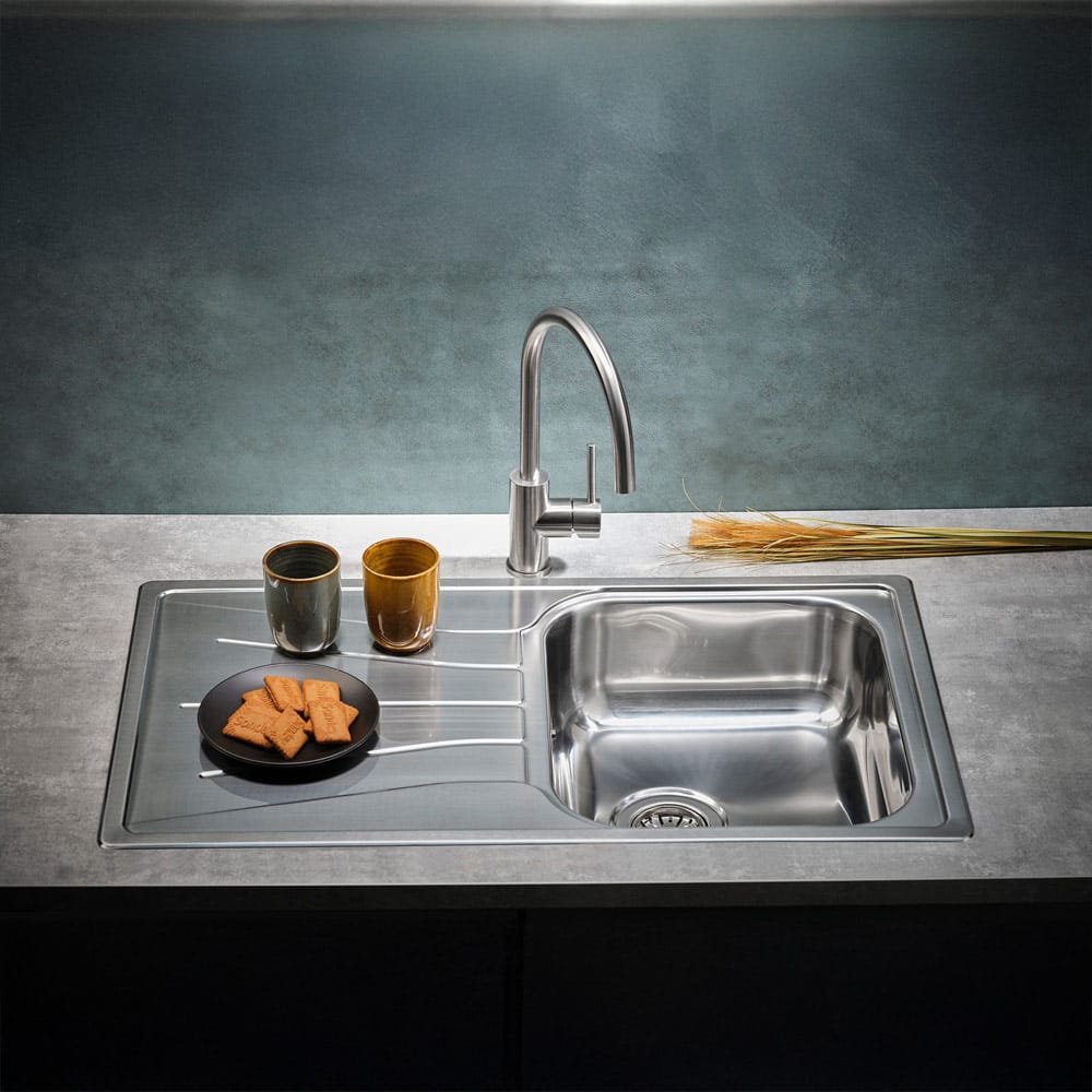Reginox Diplomat 10 Lux single bowl stainless steel kitchen sink installed in a contemporary kitchen.