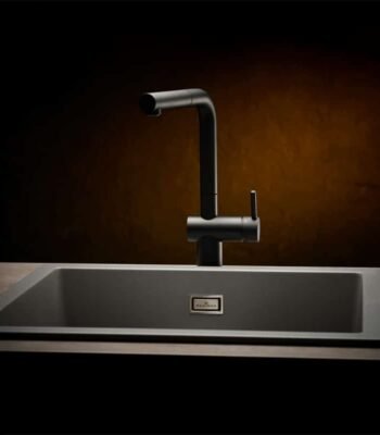 Reginox Amsterdam 50 quartz kitchen sink with dishes, showing its functionality