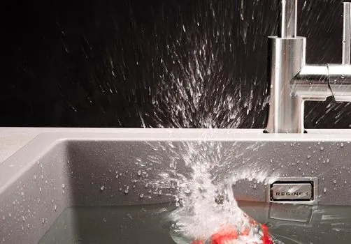 granite kitchen sink with water filling demonstrating spacious bowl