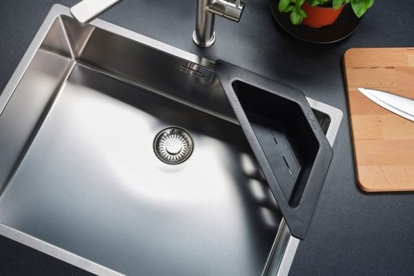 Close-up of Reginox New York 54x44 kitchen sink, showing stainless steel finish and bowl